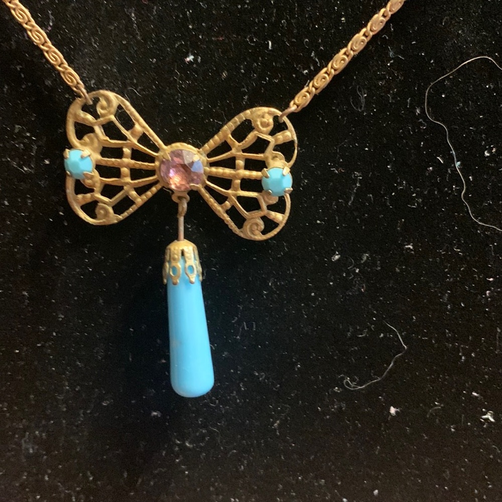 Vintage art deco necklace in brass filigree bow or butterfly necklace.